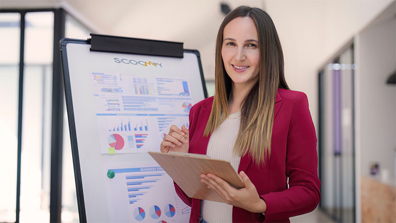 Hilda standing in the office